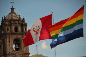 a couple of flags flying next to each other